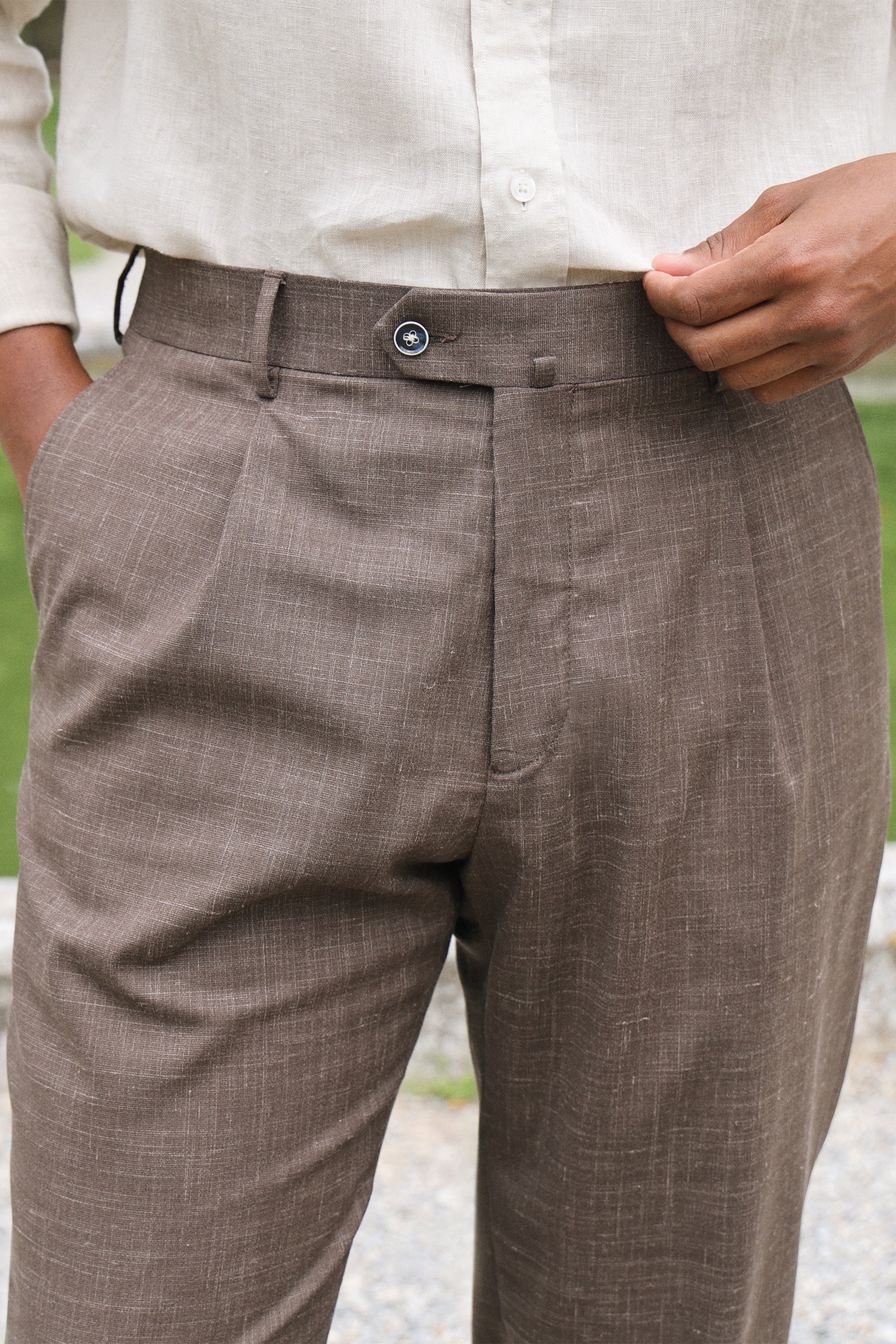 Lightweight brown pleated trousers