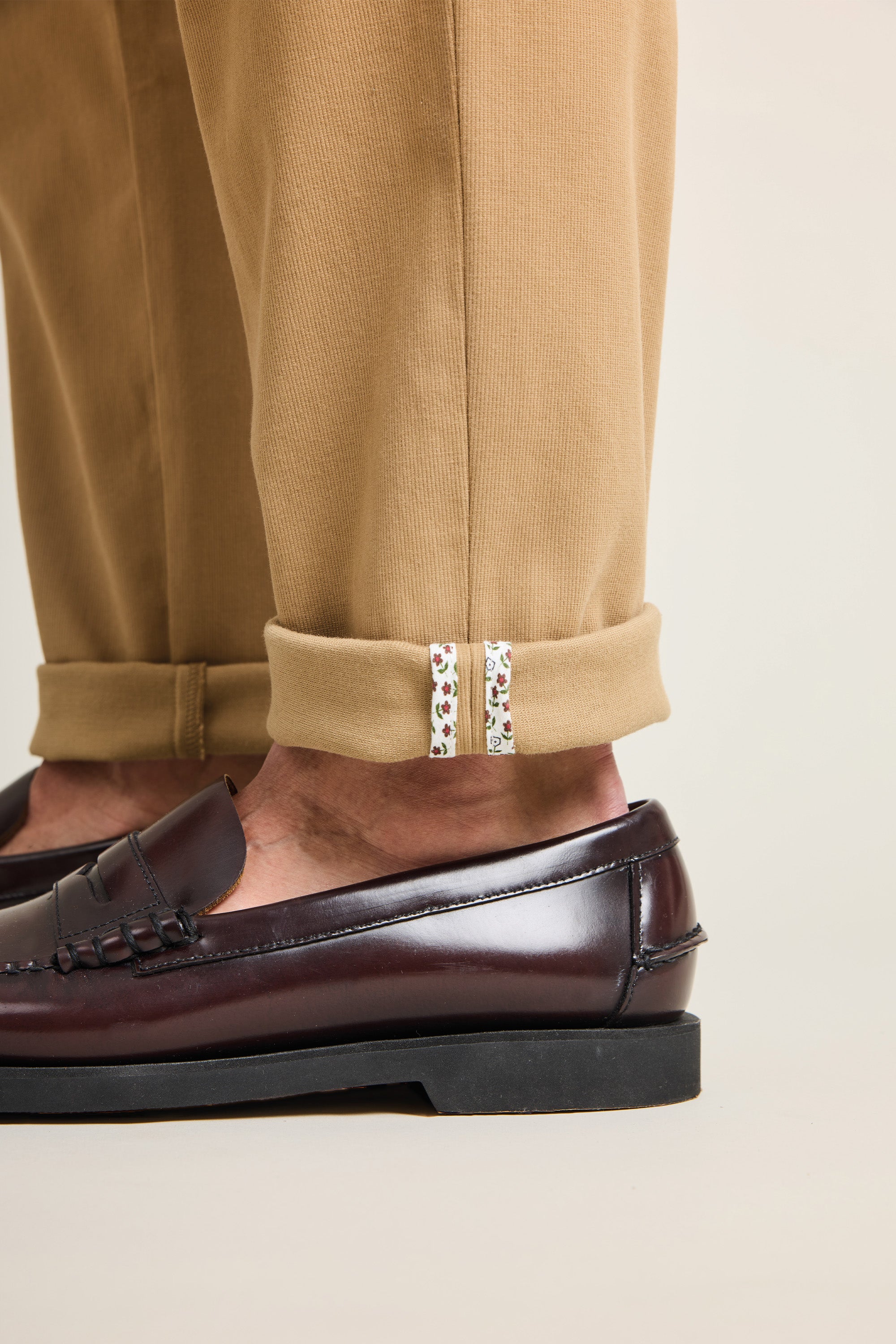 Beige pleated chinos