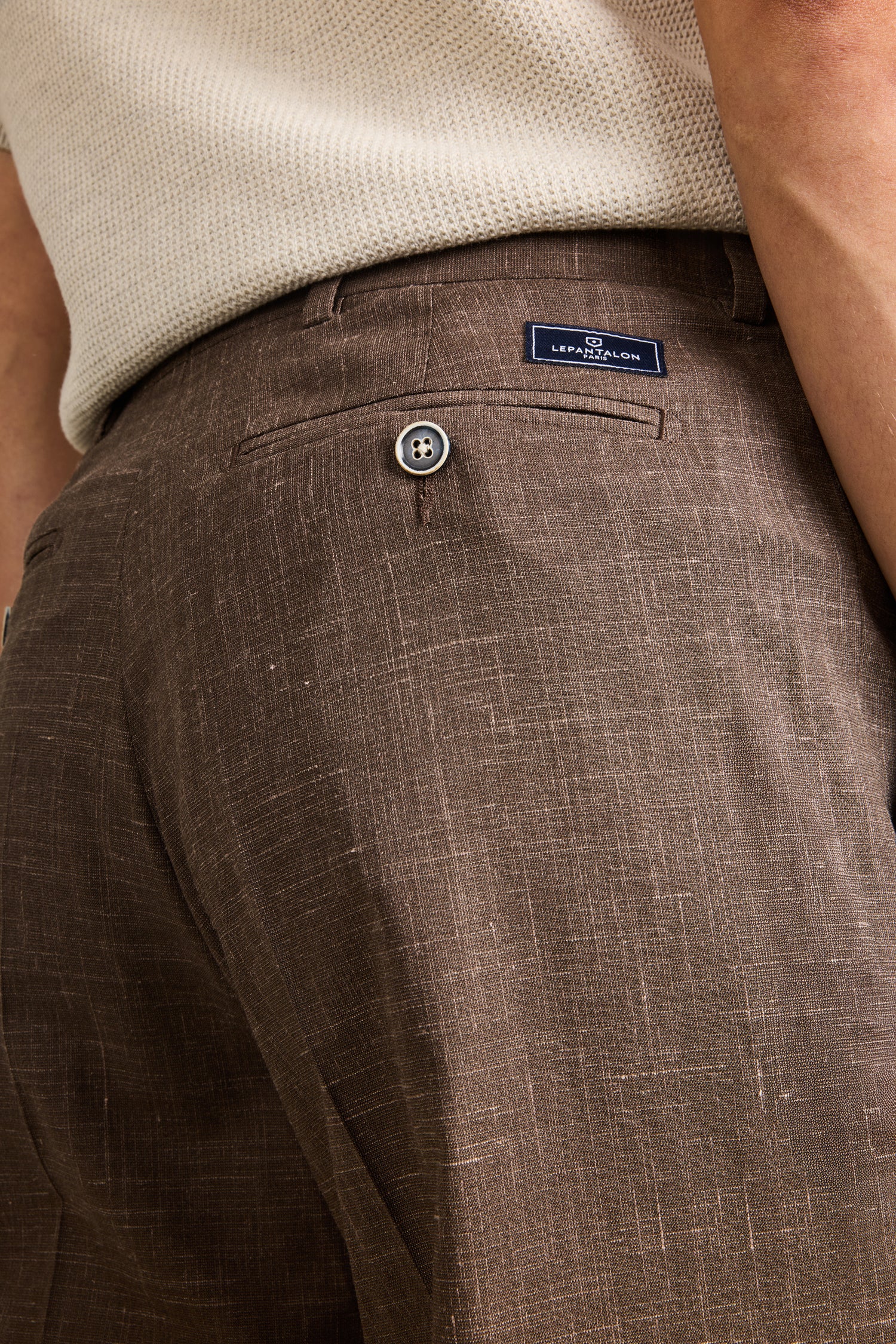 Lightweight brown pleated trousers